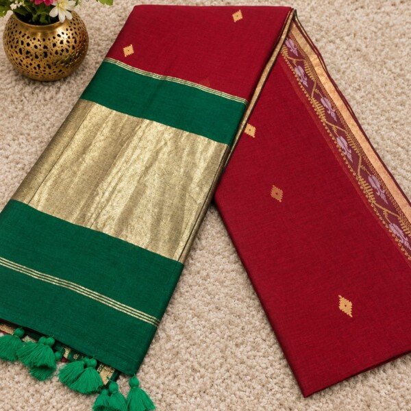 Pure cotton handwoven saree with contrast border, gold-toned detailing and tassels